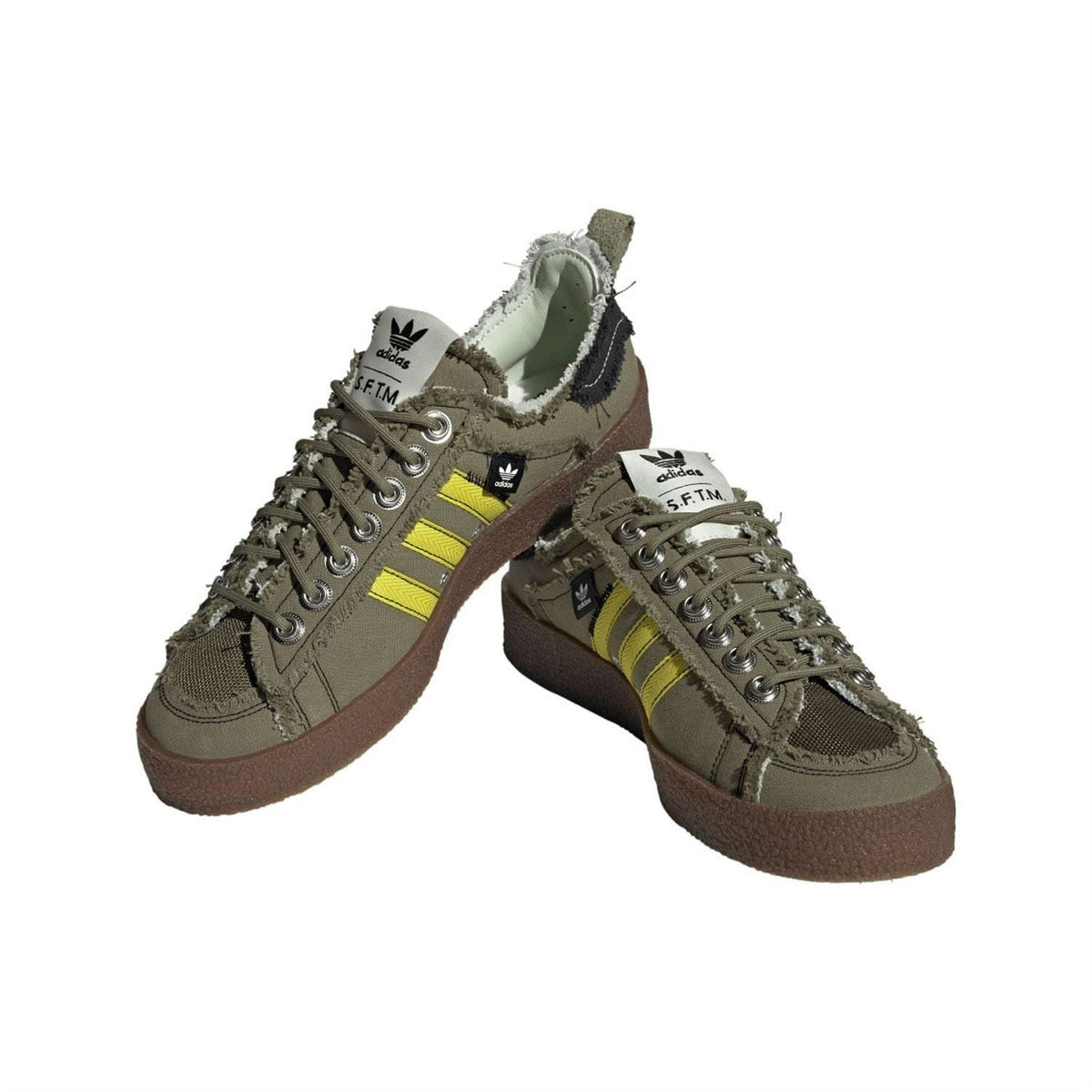 Olive trainers pair view with yellow Three Stripes, lace-up closure, and brown rubber sole