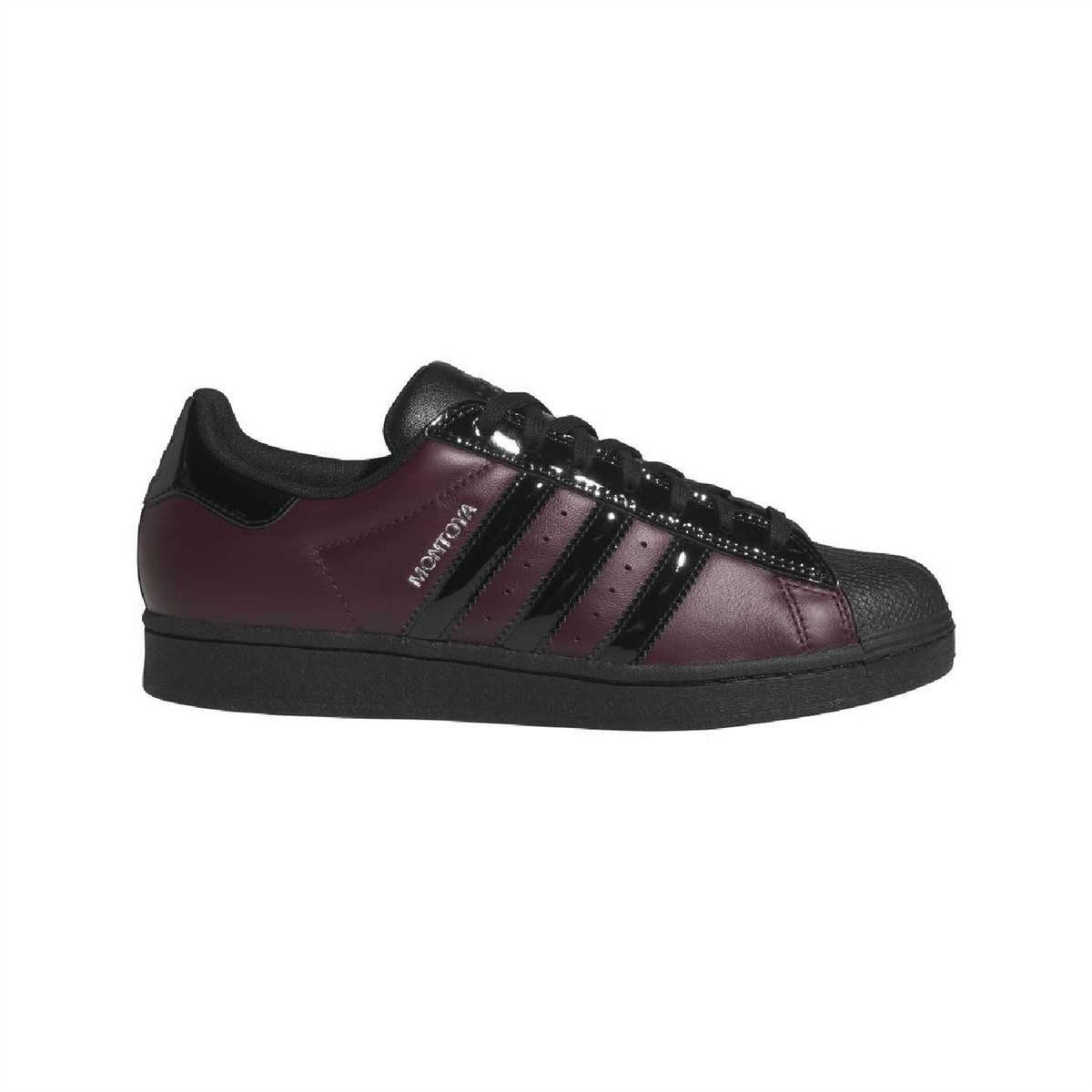 Maroon adidas sneakers with black stripes, black laces, and thick black rubber sole
