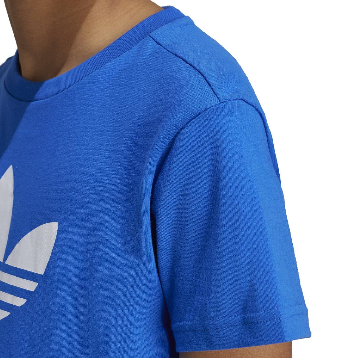 Blue adidas trefoil T-shirt close-up of short sleeve and white logo graphic