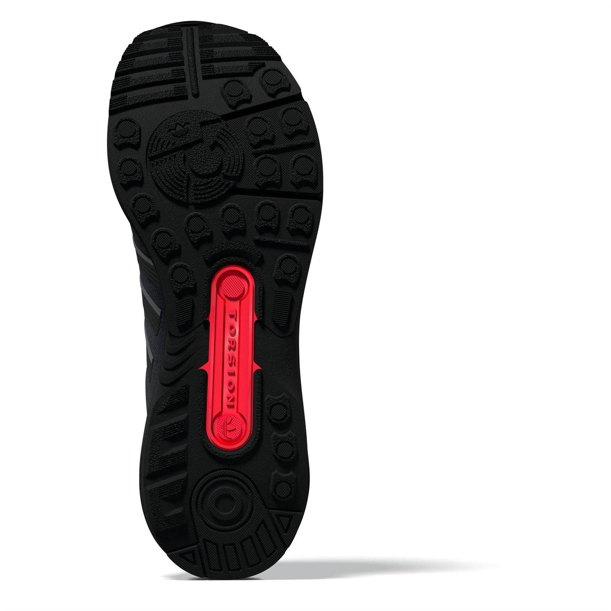 Shoe outsole view with textured traction lugs and red heel traction insert