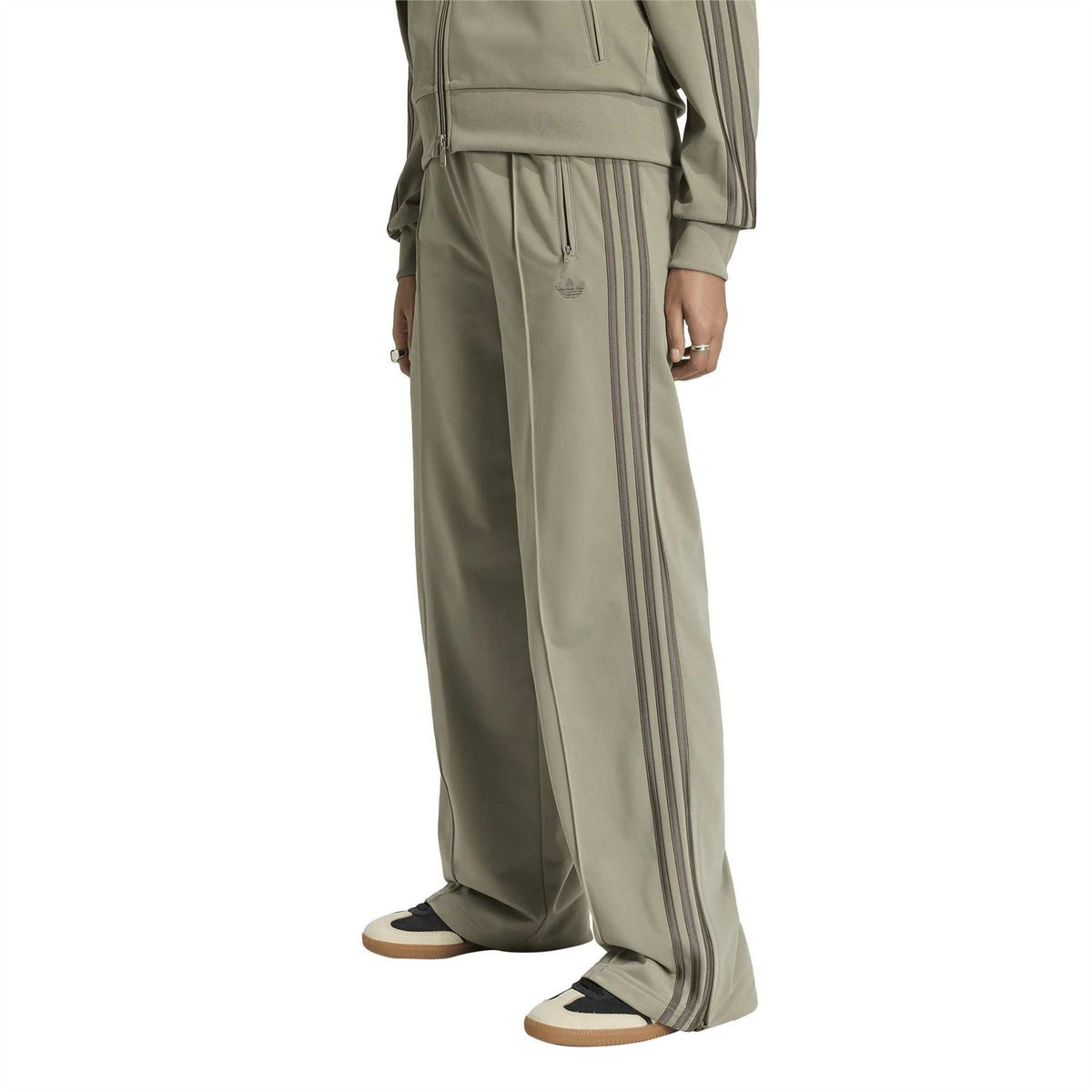 adidas Originals khaki green joggers with vertical stripes and relaxed wide legs