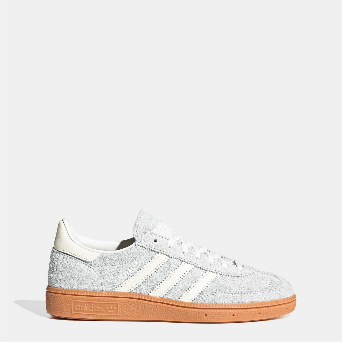 White suede low-top sneakers with lace-up front and gum rubber sole