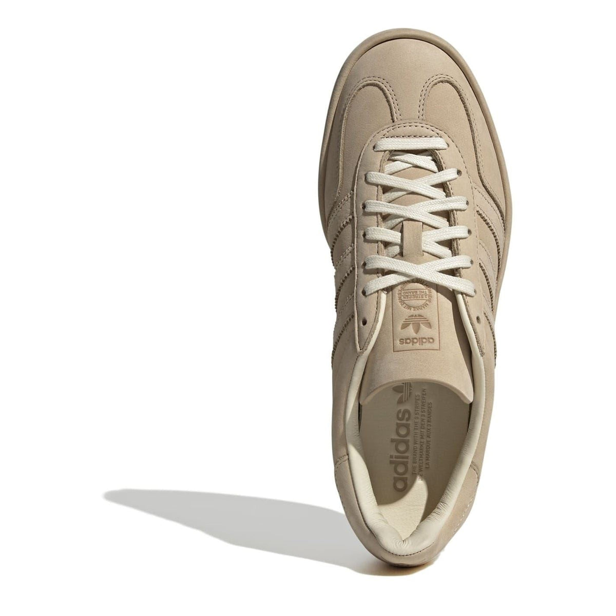 Beige lace-up sneaker with adidas and Gazelle logos on tongue and insole