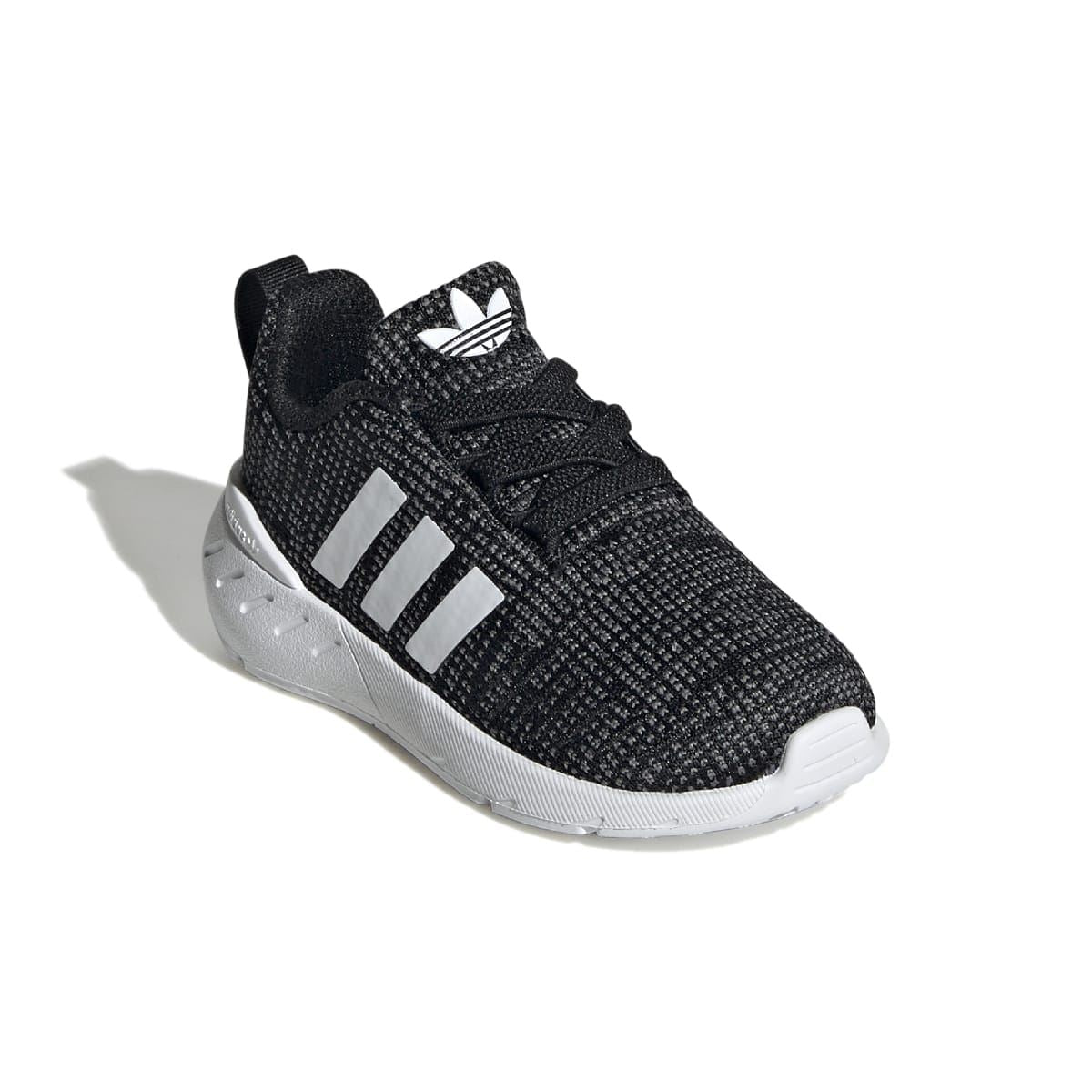 Infant black running trainers from side angle with white stripes and textured knit upper