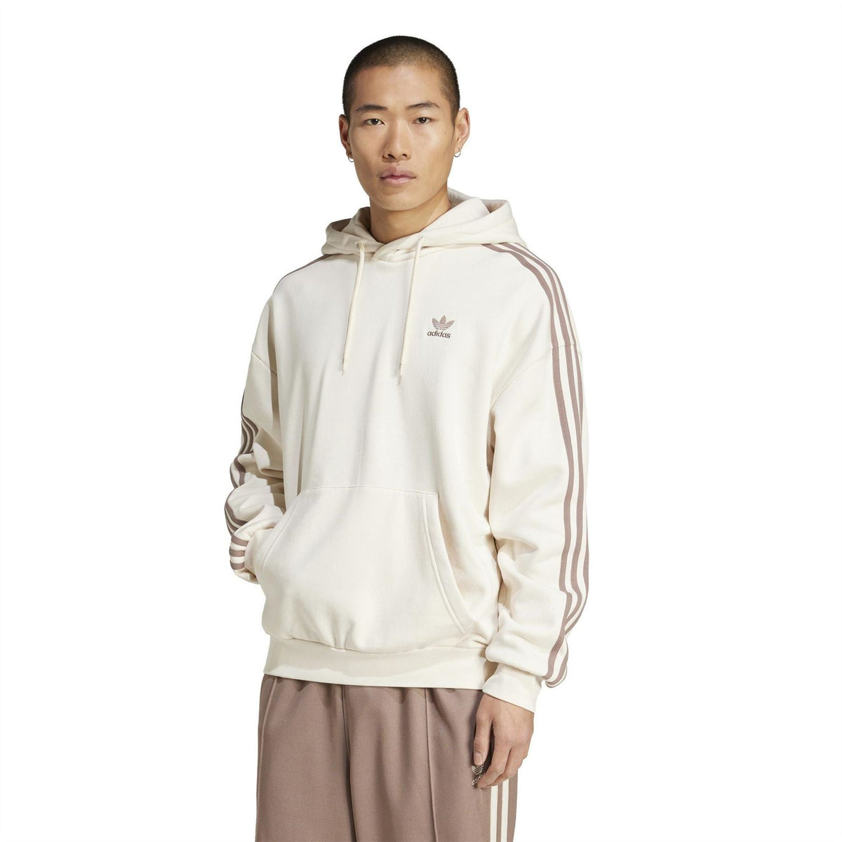 Off-white adidas Originals hoodie with three stripe sleeves and front kangaroo pocket.