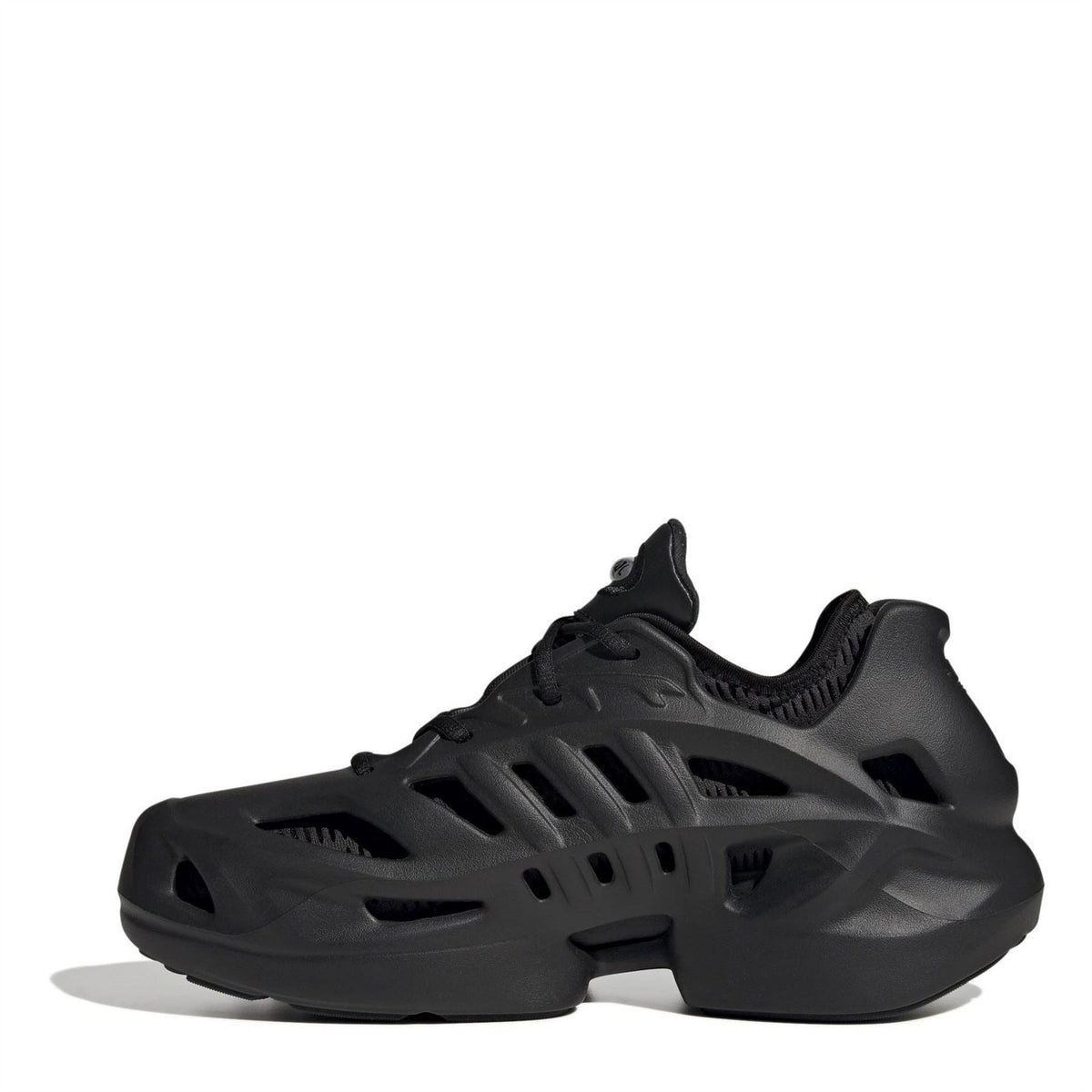 Black adidas Adifom low-top sneakers, angled side view with cutout detailing