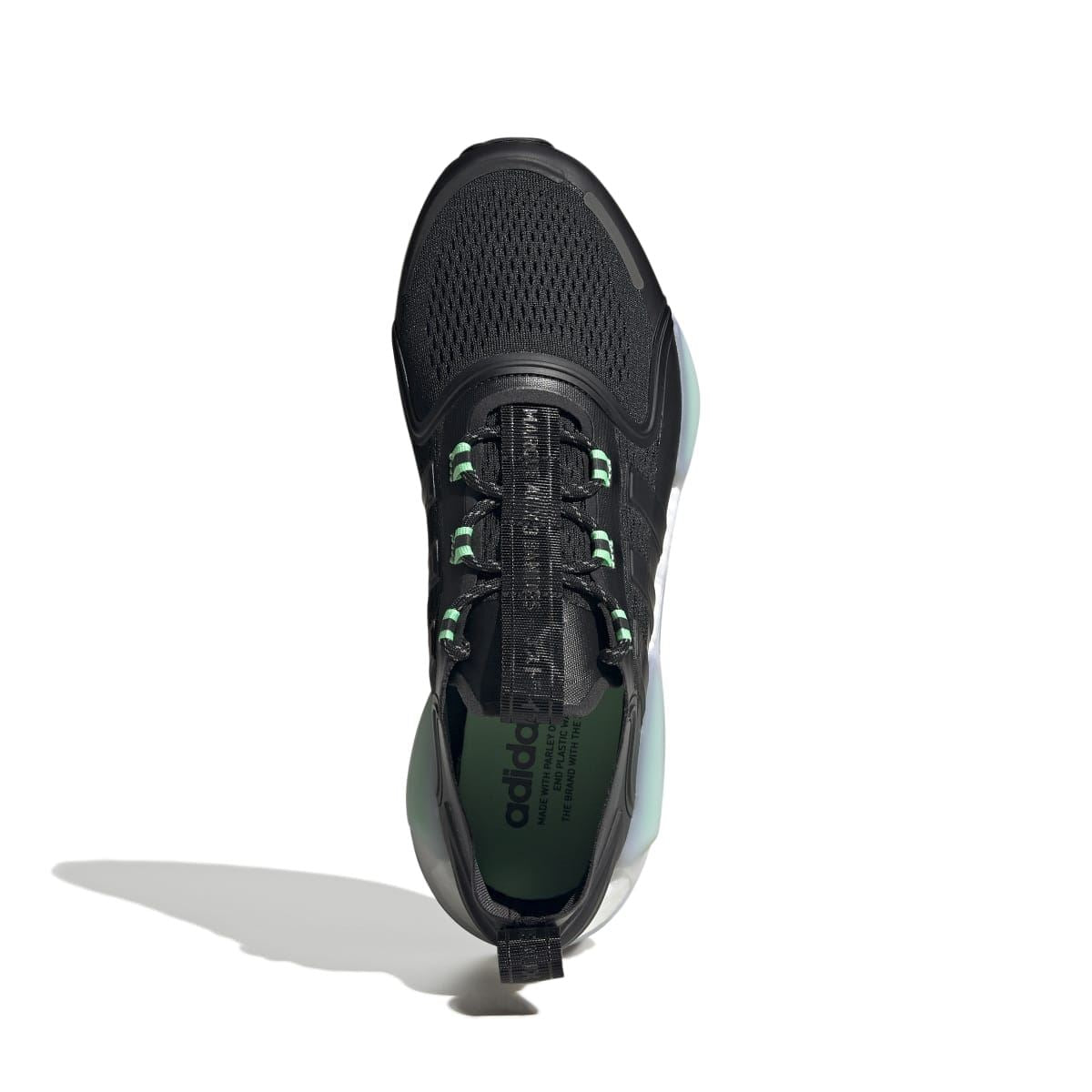 Black NMD_V3 trainers top view with green lace eyelets and padded tongue