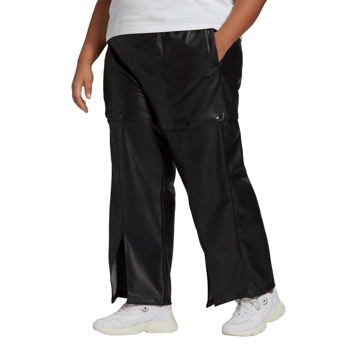 Black adidas Originals track pants with layered cargo pockets and wide straight fit