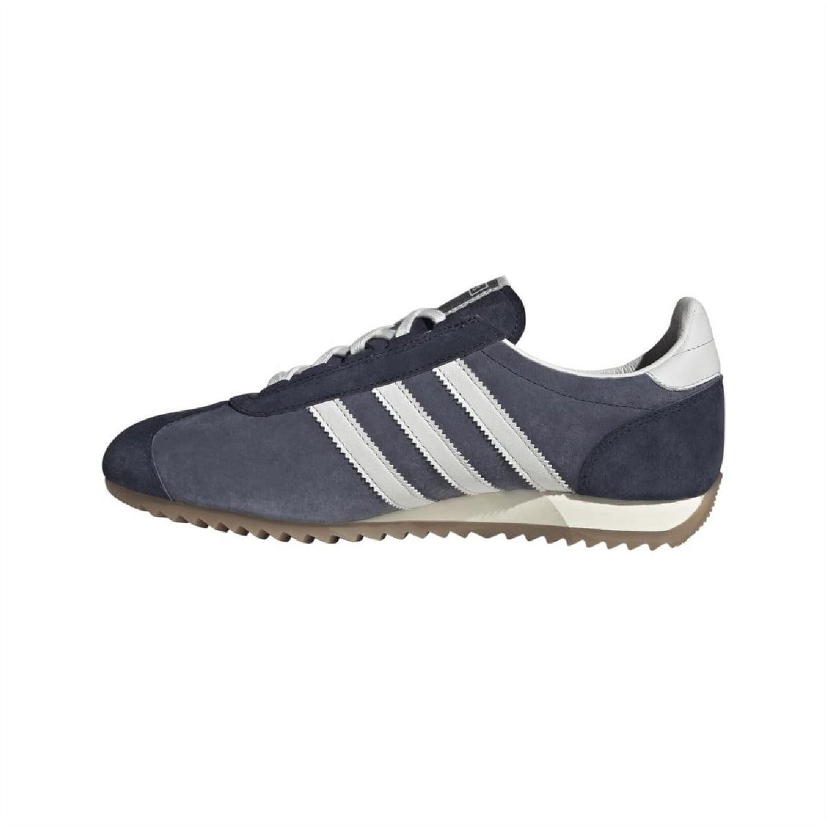 Navy suede low-top trainers with white stripes and beige-tan gum sole