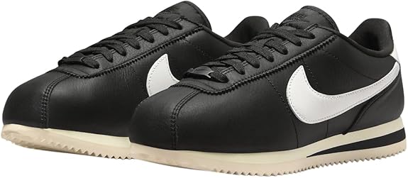 Women's Nike Cortez black leather sneakers, three-quarter view, white swoosh