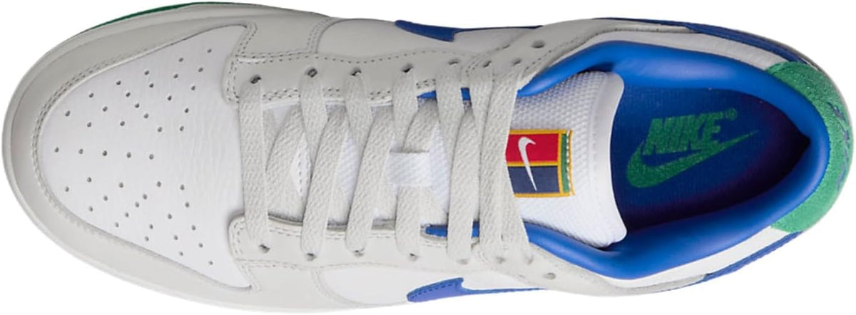 Women's Nike Dunk Low PRM sneaker close-up, white laces with blue lining and Nike logo
