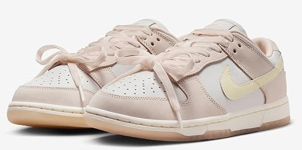 Women's Nike Dunk Low PRM sneakers, light pink with cream laces and pale yellow swoosh