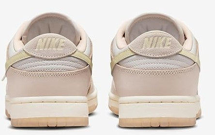 Women's Nike Dunk Low PRM sneakers, back view with Nike heel logo and light pink leather