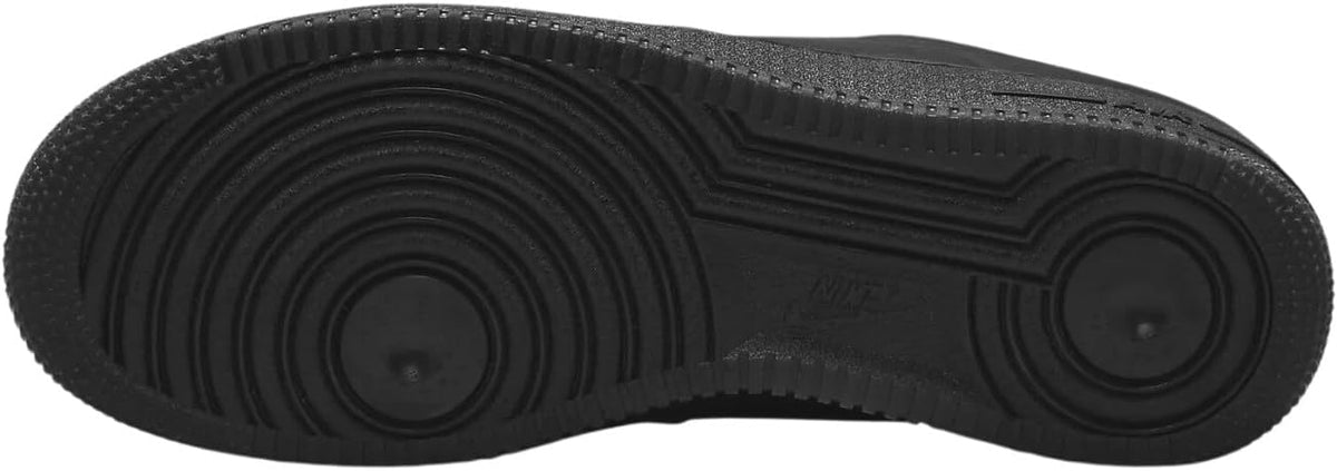 Black Nike Air Force 1 outsole with circular tread pattern and traction grooves