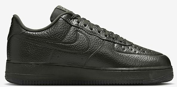 Men's low-top sneakers, dark leather with stitched panels and Nike Swoosh on side