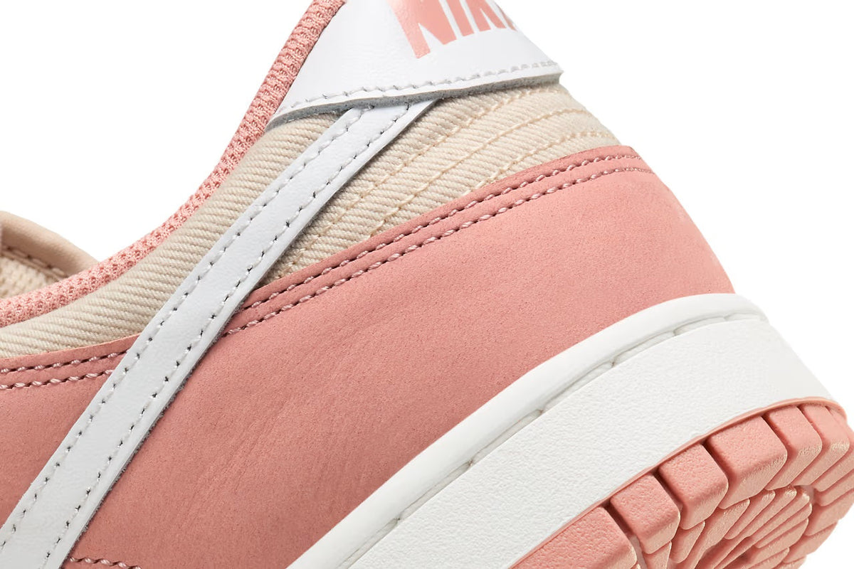 Nike Dunk Low side and sole detail in pink, cream, and white