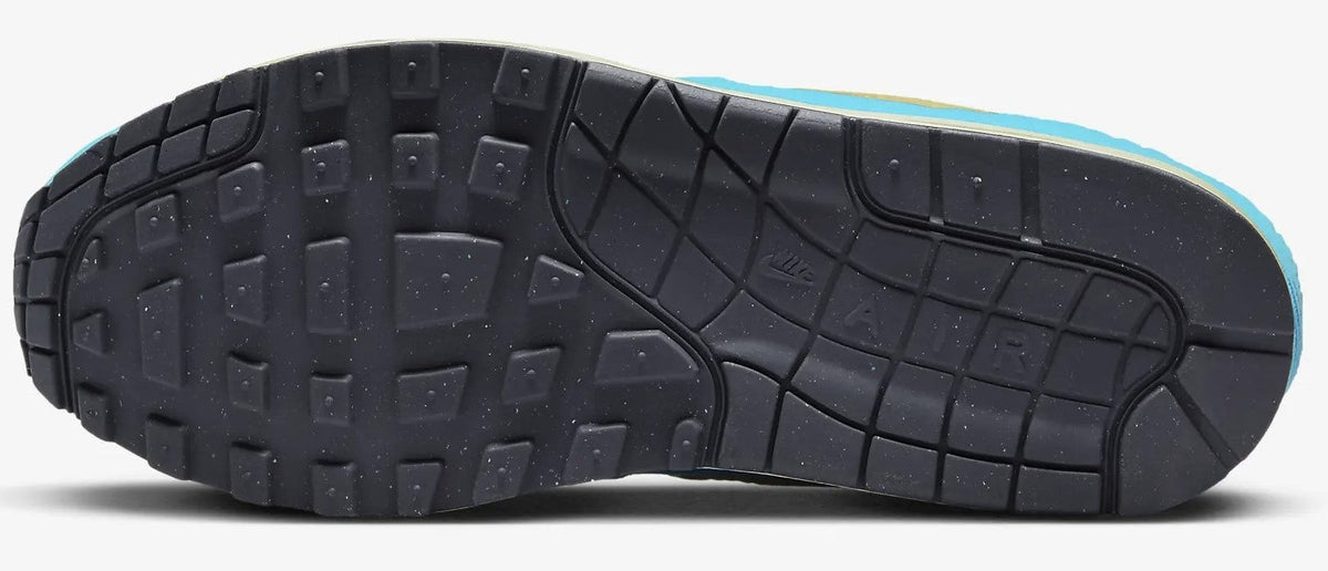 Men's Nike Air Max 1 PRM outsole view with black rubber traction and blue edge trim