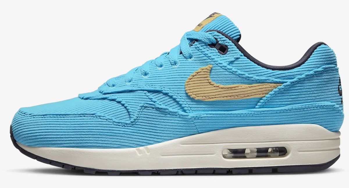 Men's Nike Air Max 1 PRM sneakers in bright blue with tan swoosh and black accents