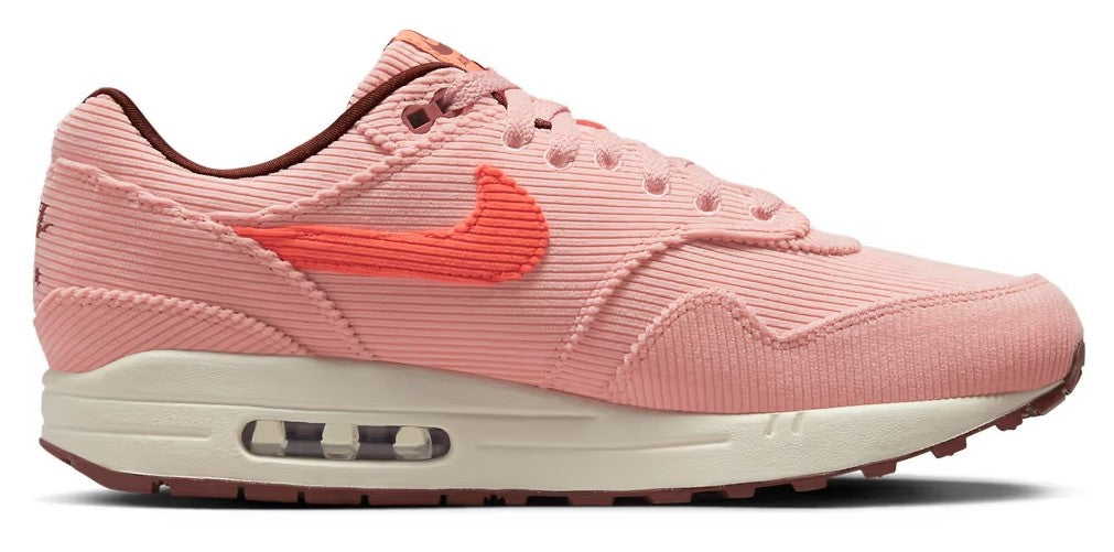 Nike Air Max 1 PRM pink coral knit sneakers with orange Swoosh and Air window on white sole