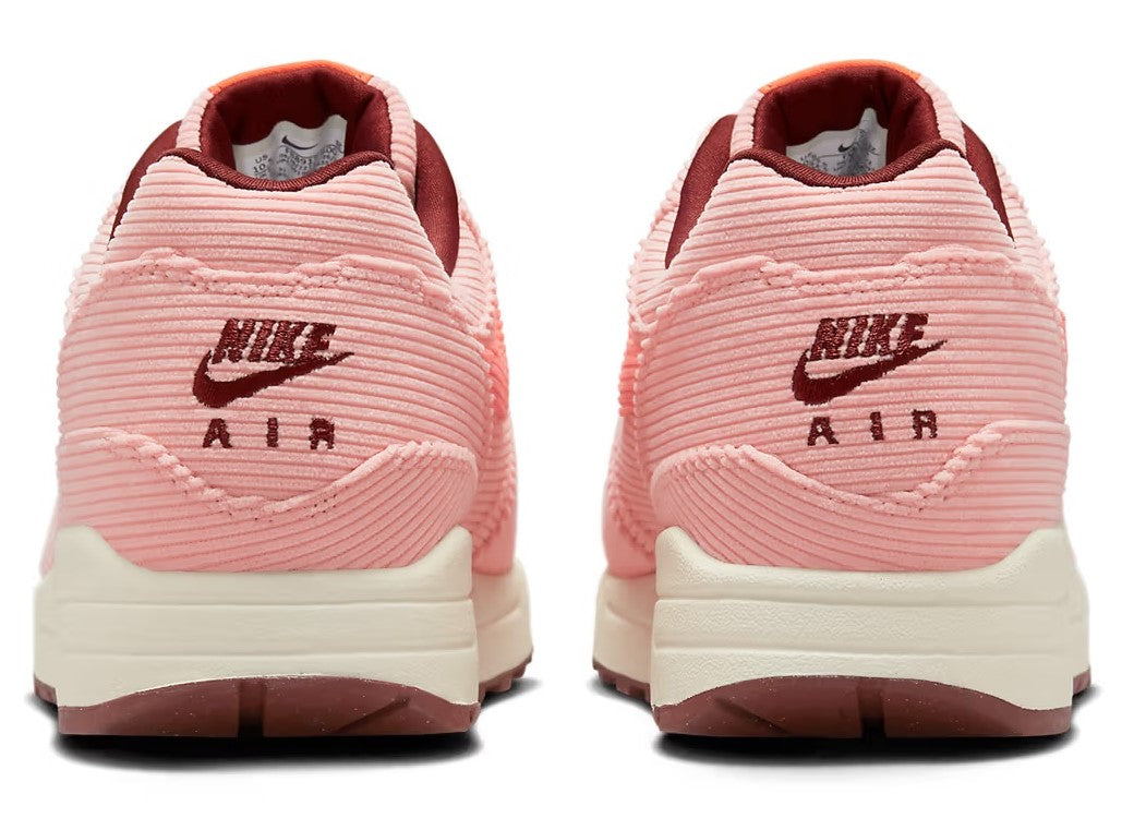Nike Air Max 1 PRM coral-pink sneakers, heel and rear logos with white midsole and dark outsole