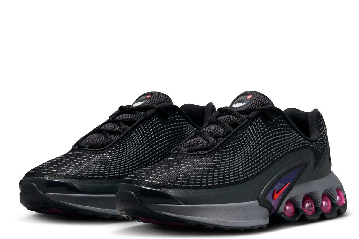 Kids' Nike Air Max DN two-shoe pair view, black knit upper with magenta air pods