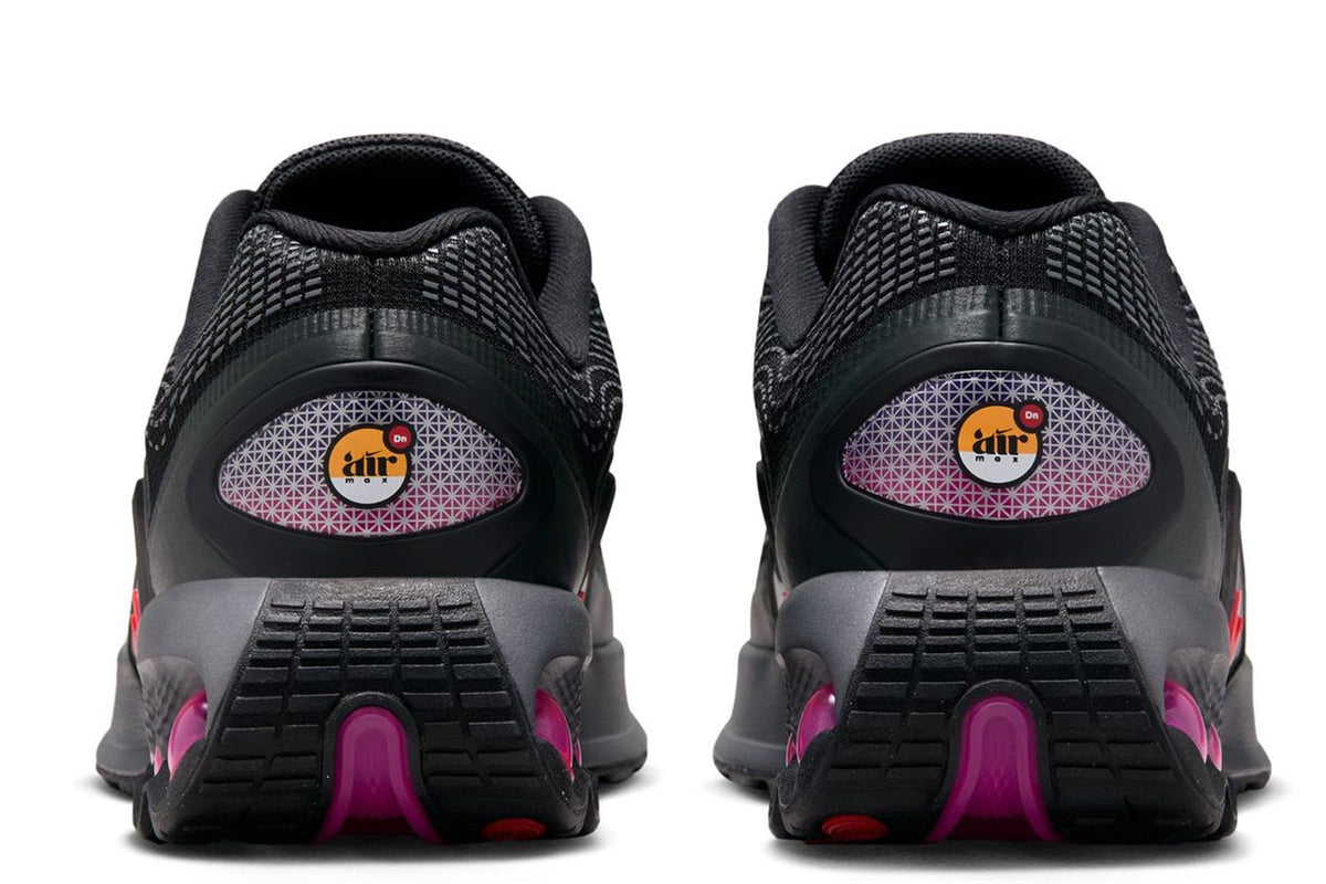 Kids' Nike Air Max DN heel view, black cushioning with magenta lining details