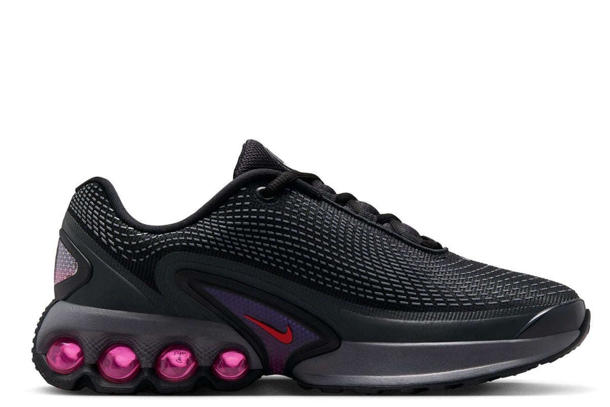 Kids' Nike Air Max DN side view in dark gray-black with magenta accents