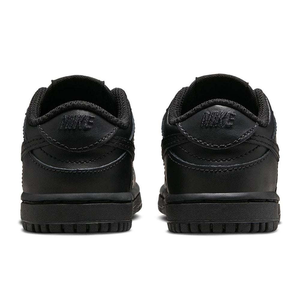 Kids' black Nike Dunk Low sneakers from back, padded heel and lace loops