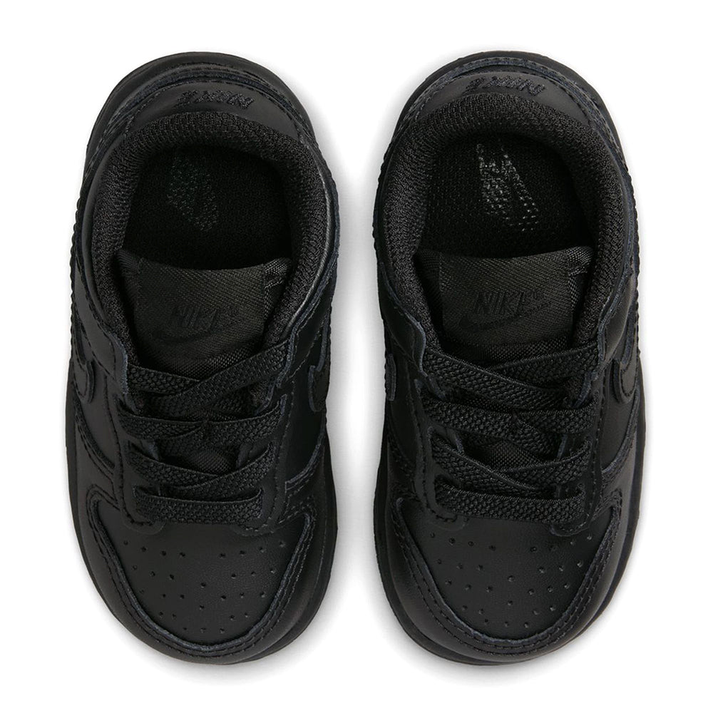 Kids' black Nike Dunk Low sneakers with black interior lining and lace details