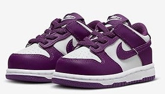 Toddler Nike Dunk Low sneakers, side view with purple leather overlays and white toe box