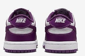 Toddler Nike Dunk Low sneakers, back view with Nike logo on purple heel and white sole