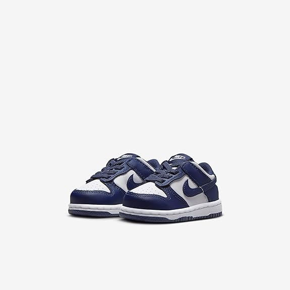 Toddler low-top sneakers, navy blue and white, Nike swoosh, lace-up front view