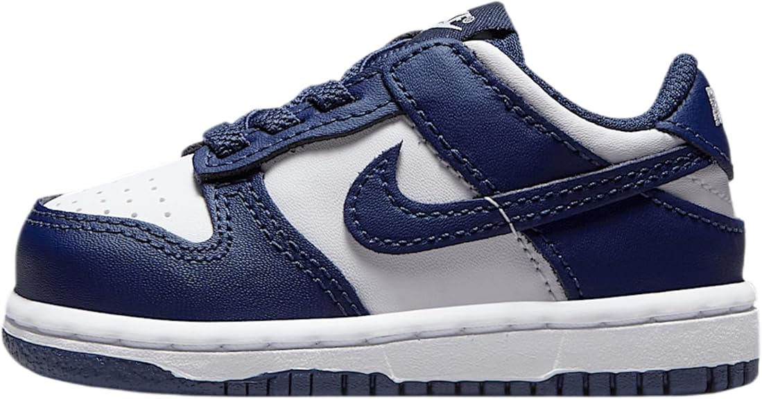 Toddler low-top sneakers, navy blue and white, with Nike swoosh and laces