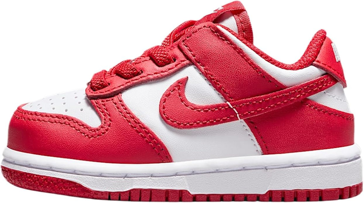 Toddler Nike Dunk Low sneaker in white and red with swoosh and lace-up design