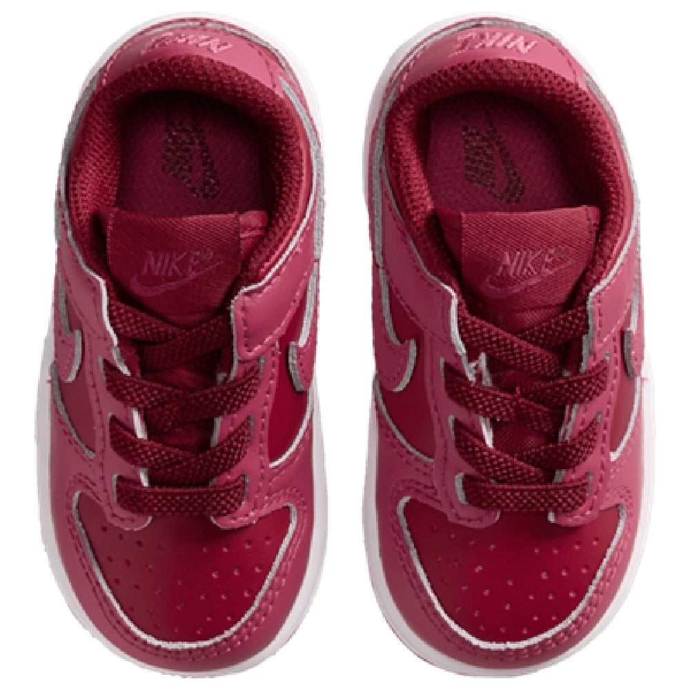 Toddler Nike Dunk Low sneakers, burgundy uppers with Nike logo on tongue