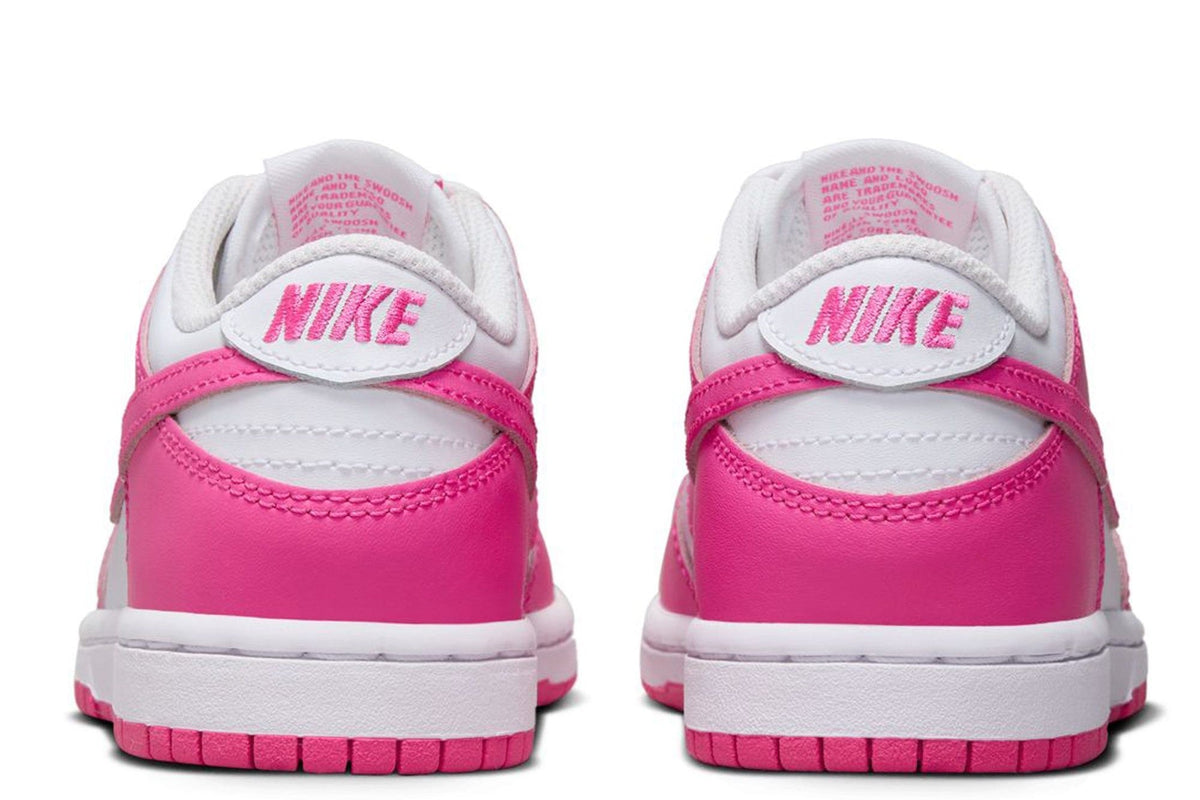 Kids' Nike Dunk Low sneakers, white heel with fuchsia back panel and Nike logo