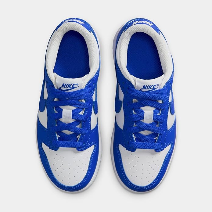 Pair of Nike Dunk Low kids sneakers in white and Hyper Royal blue with blue laces