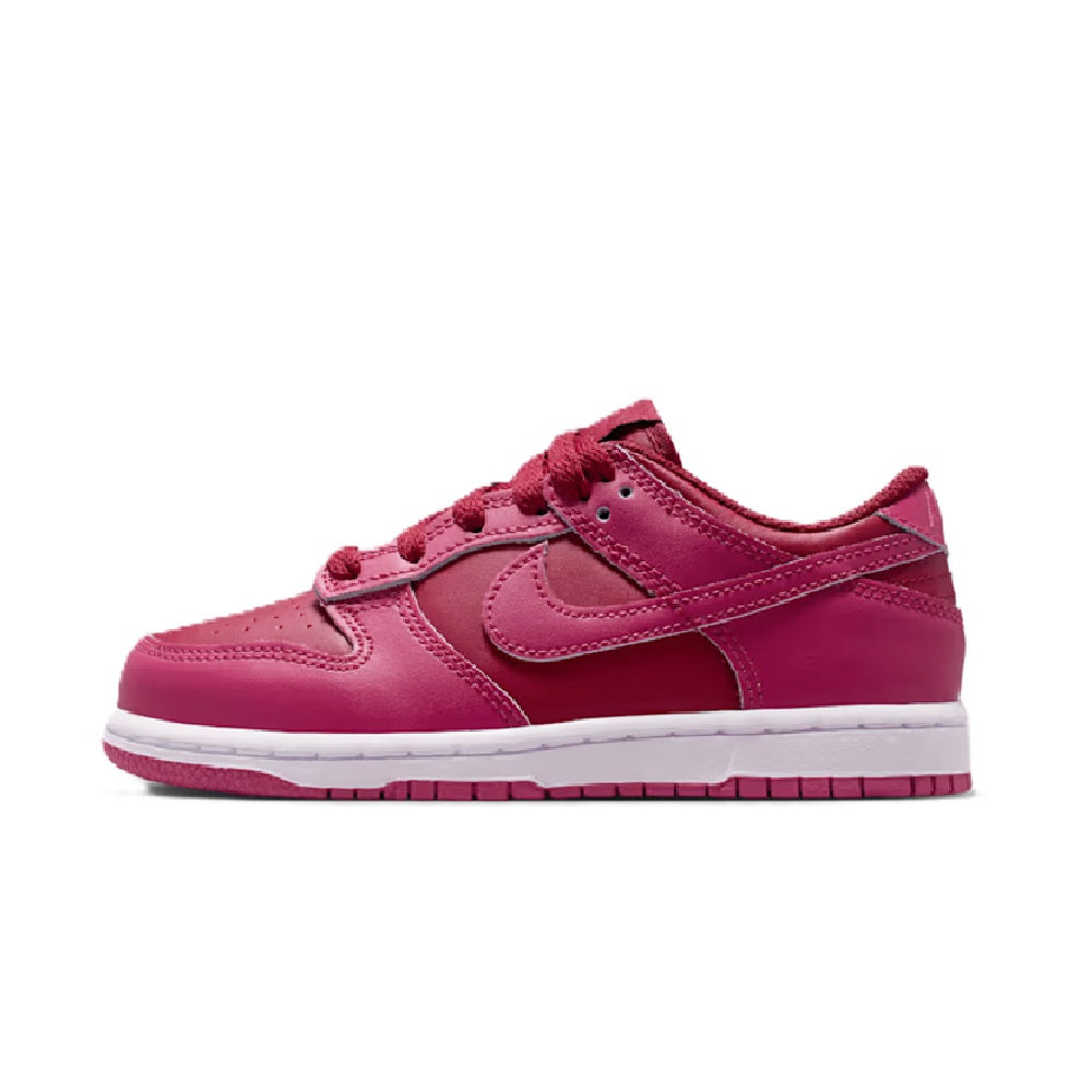Kids' Nike Dunk Low low-top sneakers, pink leather upper, lace-up with white midsole.