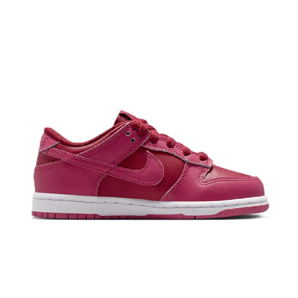 Kids' Nike Dunk Low low-top sneakers, pink panels, lace-up, side swoosh, white midsole.