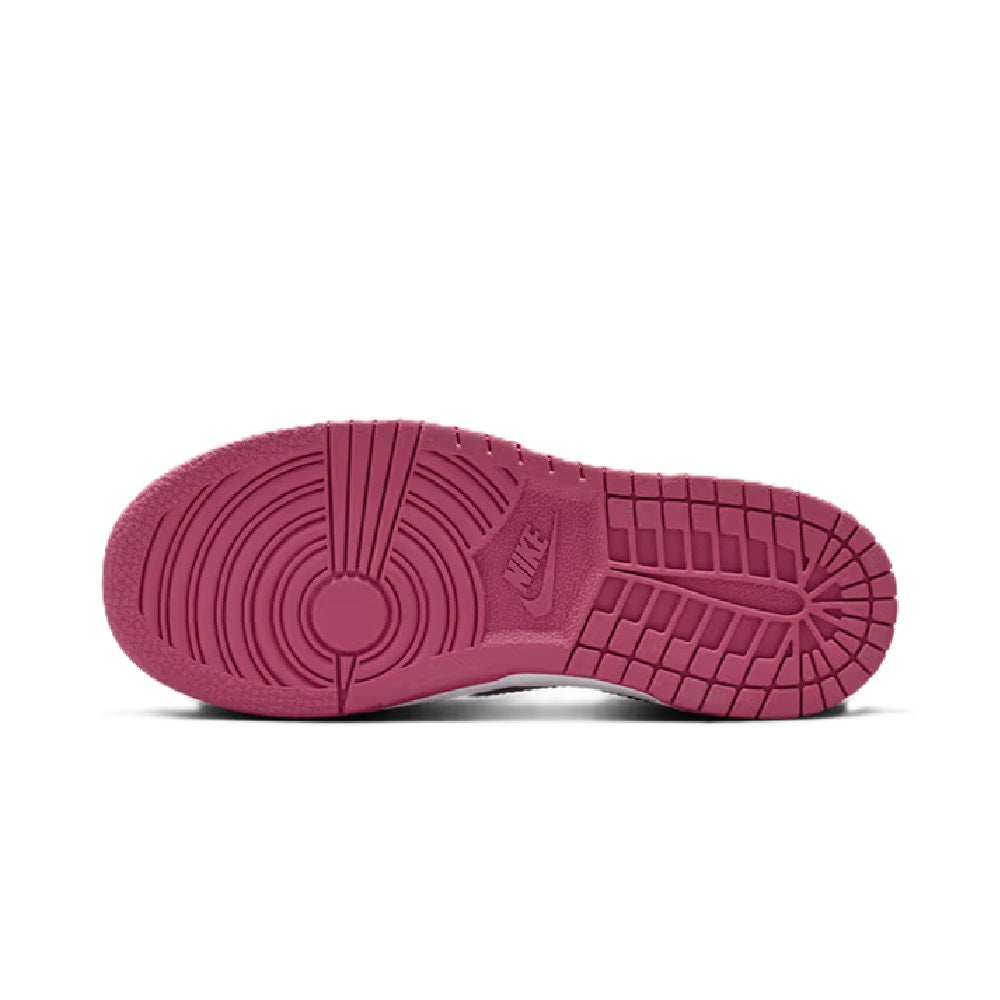 Kids' Nike Dunk Low outsole, pink rubber tread with grid pattern, white sidewall.