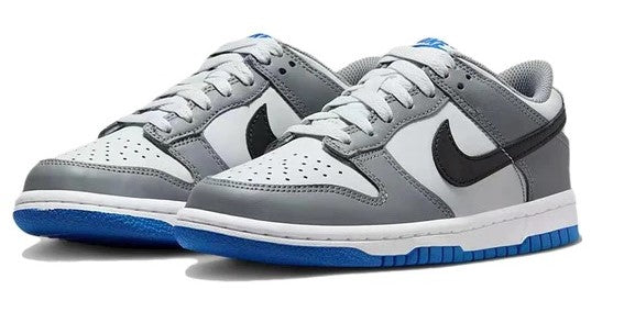 Kids' Nike Dunk Low sneakers, grey-and-white colorblock with black swoosh and blue sole