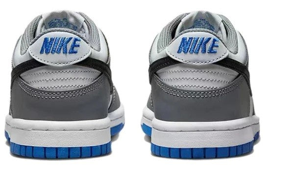 Kids' Nike Dunk Low sneakers with grey heel tabs, black overlays, blue outsole