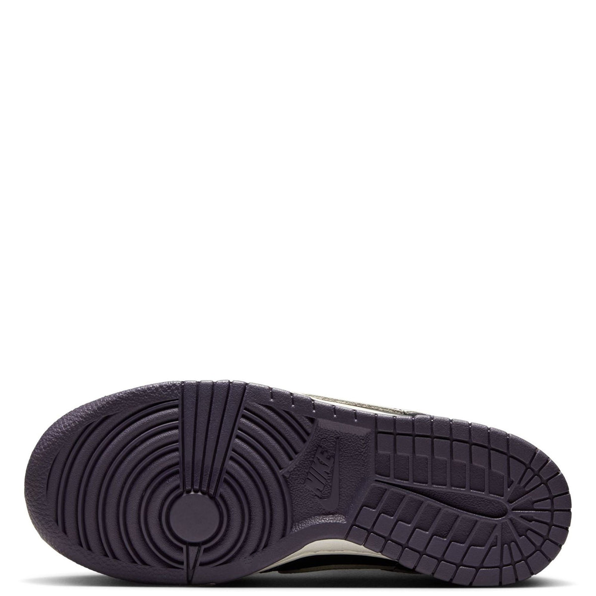 Kids' Dunk Low sneaker outsole view with dark rubber tread and pivot-circle pattern