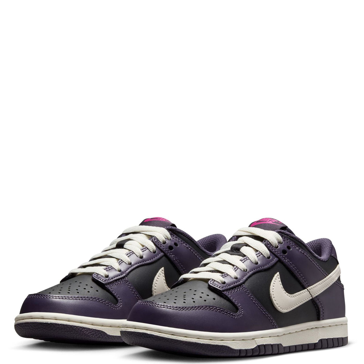 Pair of kids' low-top sneakers in dark purple with white laces and cream swooshes