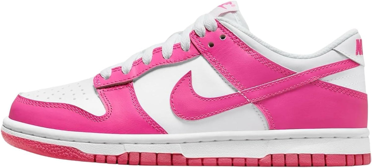 Nike Dunk Low big kid sneakers with white leather and hot pink Swoosh, lace-up front