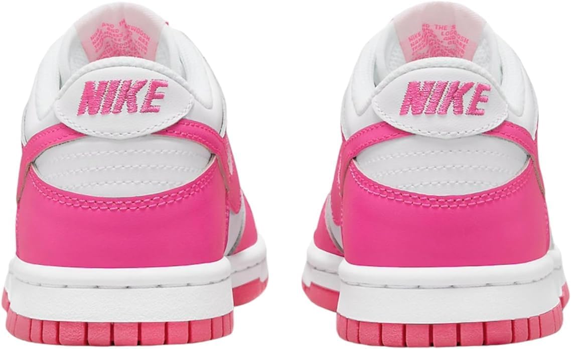Nike Dunk Low big kid sneakers, hot pink heel and tongue with Nike logo, rear view