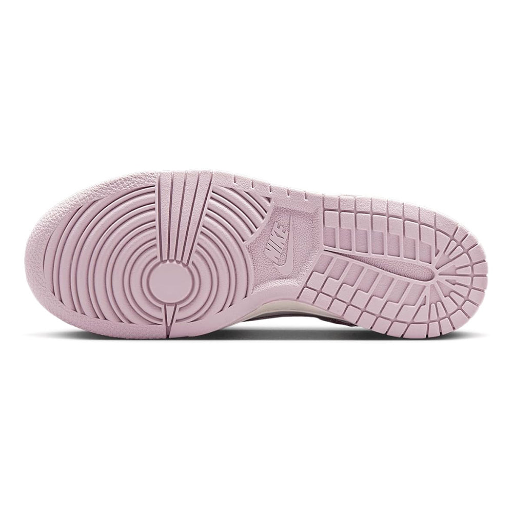 Big kid's Nike Dunk Low outsole, pink tread with Nike mark, low-top sneakers.