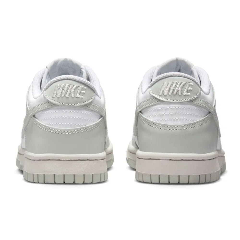 Kids' low-top sneakers, white uppers with light silver heel tab and NIKE branding