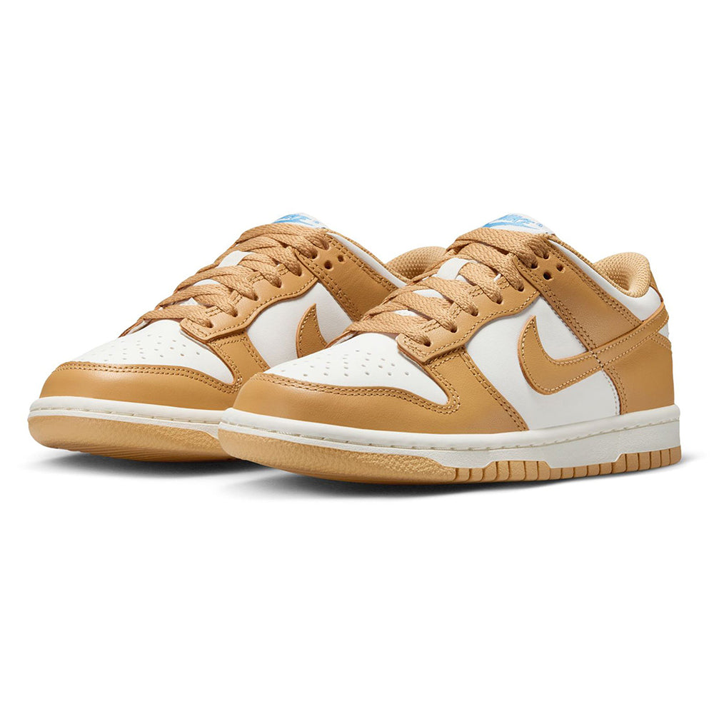 Kids' Nike Dunk Low sneakers with tan laces, tan leather overlays, and white toe panels