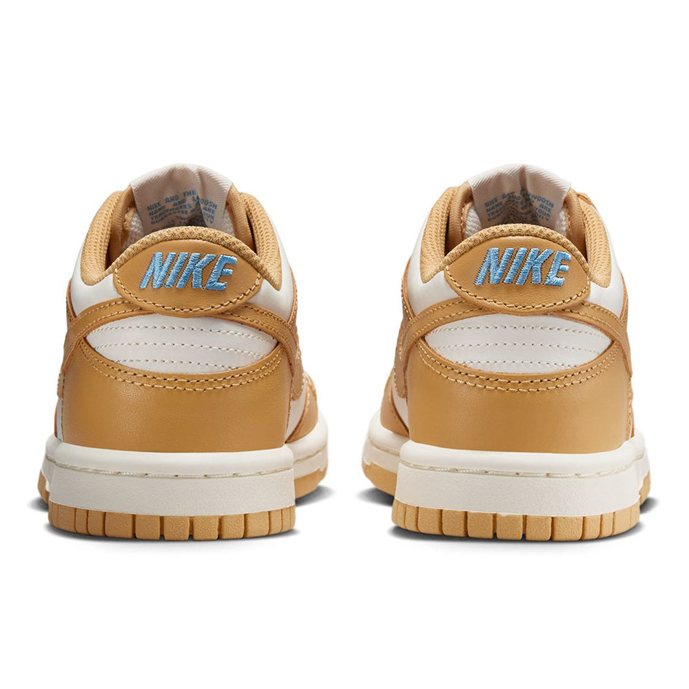 Kids' Nike Dunk Low sneakers with Nike logo on tan heel and white midsoles